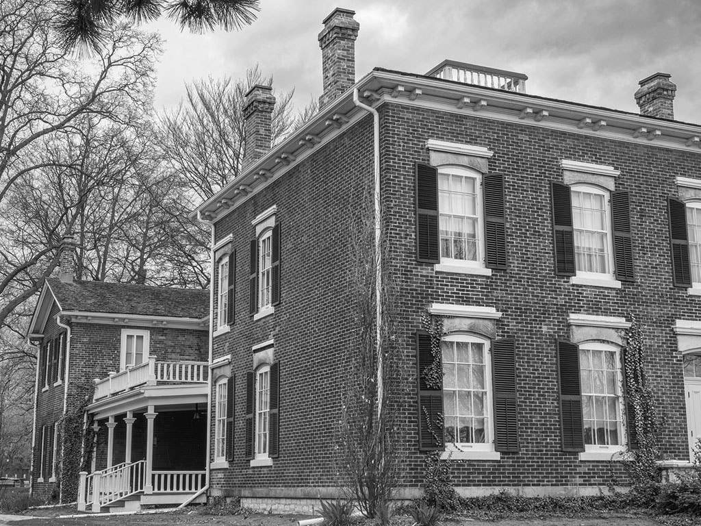 Oakville, Ontario - 2024-05-03: The Erchless Estate, a historic brick mansion nestled among mature trees, stands as a testament to Oakville’s heritage. Once the residence of the town’s founding family, this elegant structure now serves as the Oakville Museum, offering a gateway to the community’s rich history.